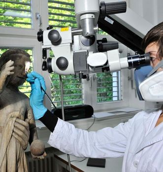 Restorer Magdalena Schlesinger at work on the Madonna