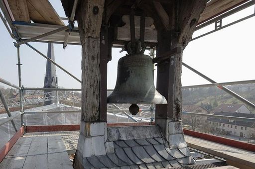 Old bell hanging from the small ridge turret